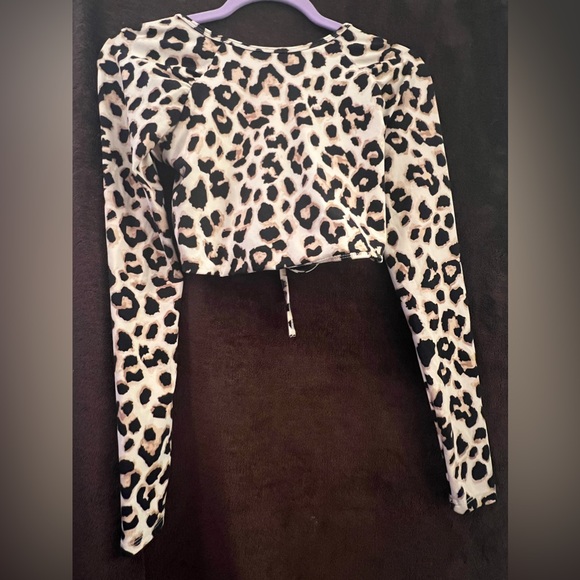 One of my favorite pieces . A crop leopard print with back tie strap down - Picture 2 of 2